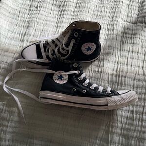 Black and white converse high tops
